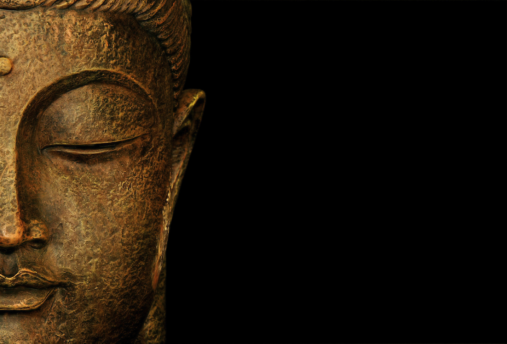 Statue representing the portrait of Buddha in meditation. Copy space.